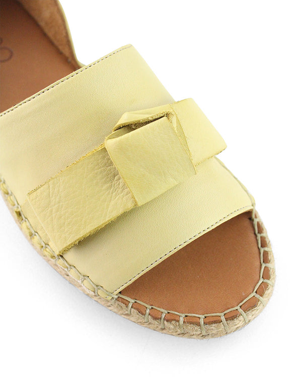 Women&#39;s Espadrille Flats in light yellow showing the peep toe