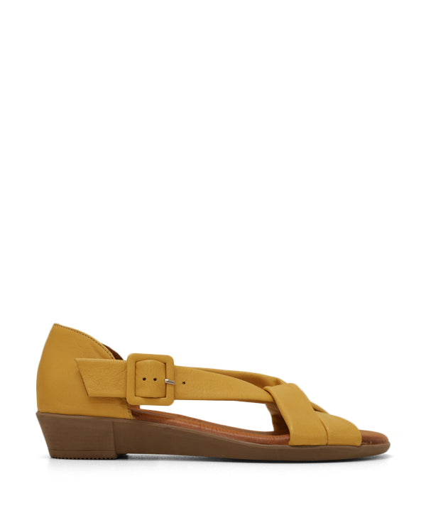 Tan leather full wrap women's sandal with buckle.