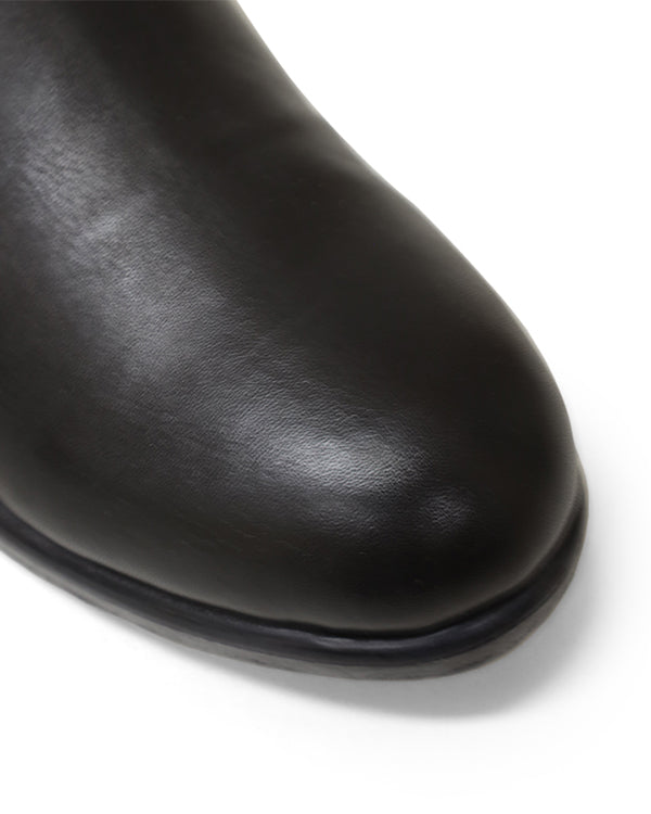 Close up of rounded toed ankle boots
