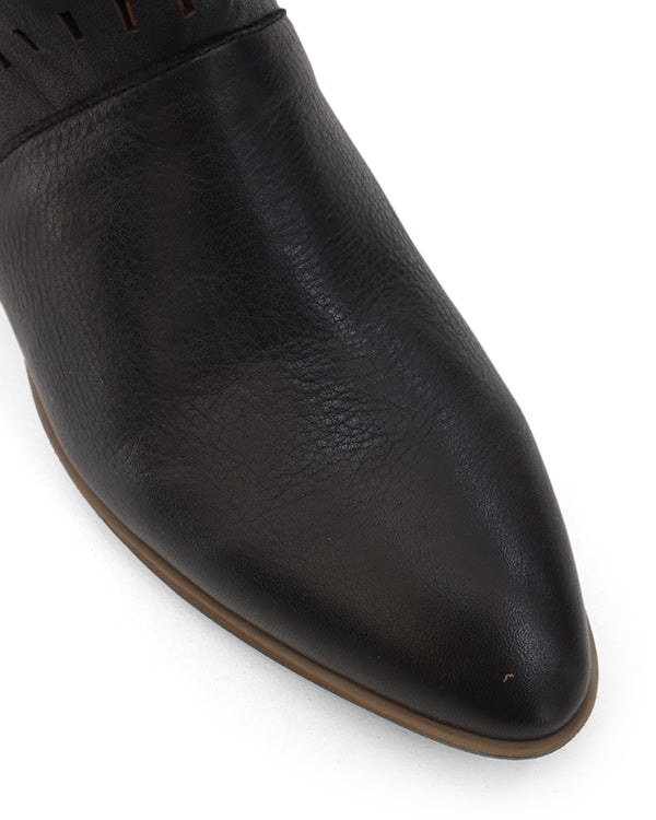 Toe close up of black leather ankle boot